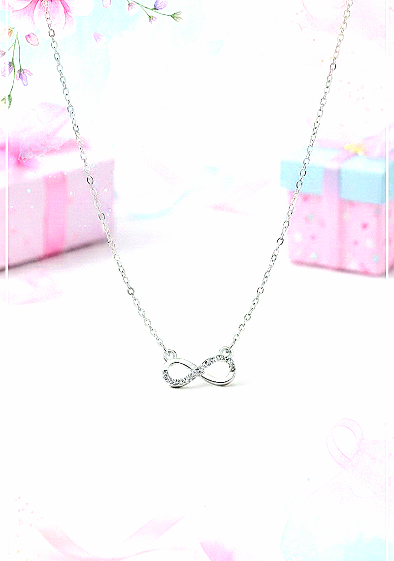 Colgante de Acero Inoxidable con simbolo de Infinito y cristalitos brillantes con fondo de colores pastel