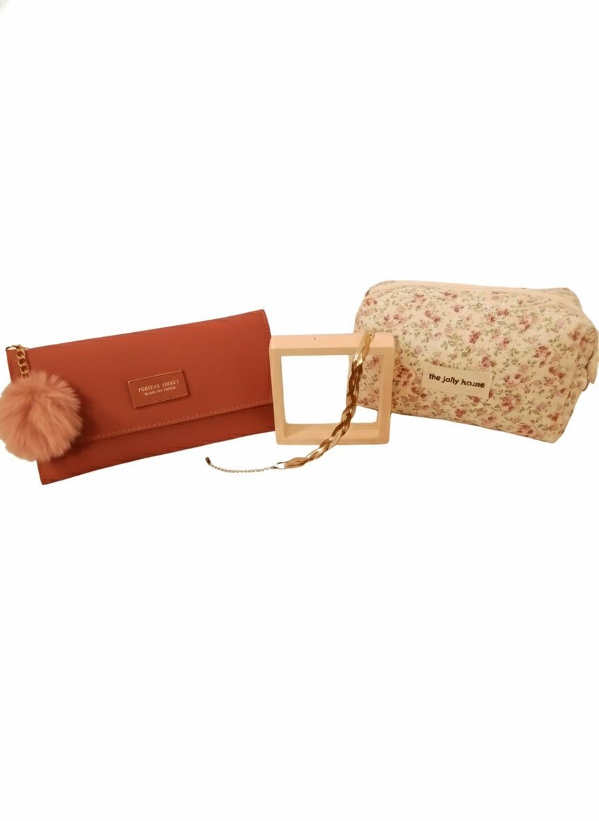 Monedero rosa con pompon, pulsera trenzada de Acero inoxidable y neceser octagonal de cremallera con estampado floral.
