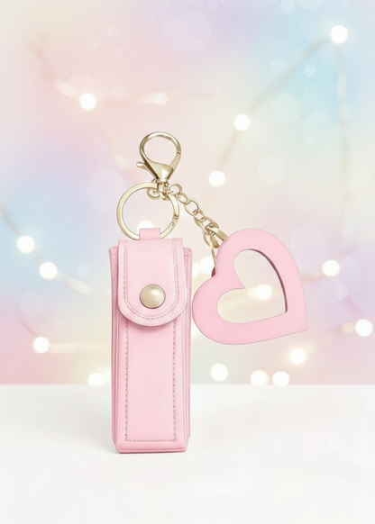 Estuche porta-labial de cuero sintético rosa y espejo con forma de corazón para bolso.
